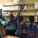 5 women checking food stock